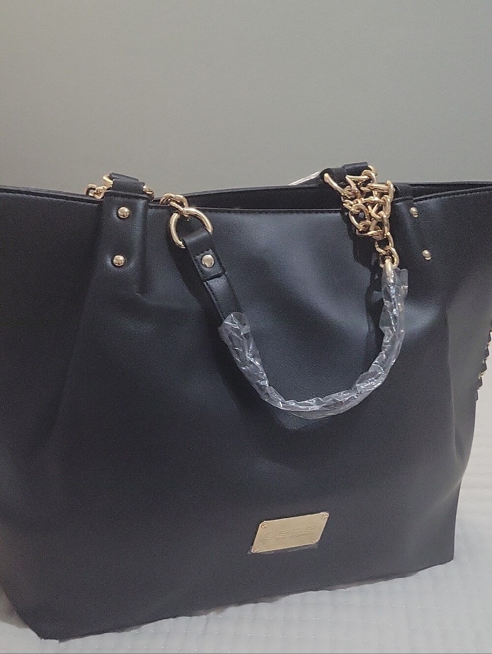 Bebe Black Tote Handbag with Gold Chain Accents